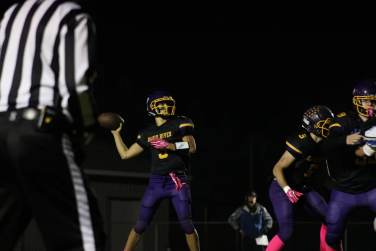 Rockets take off, defeat Cougars in 8-man action